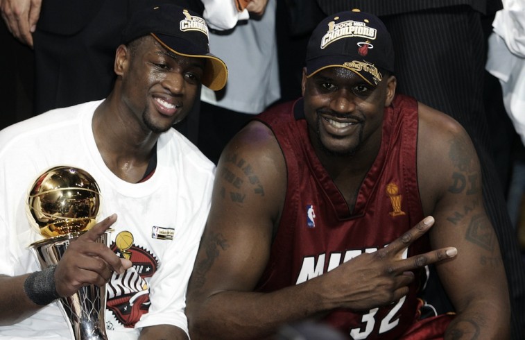 Dwyane Wade and Shaquille O'Neal celebrate winning a championship for the Miami Heat