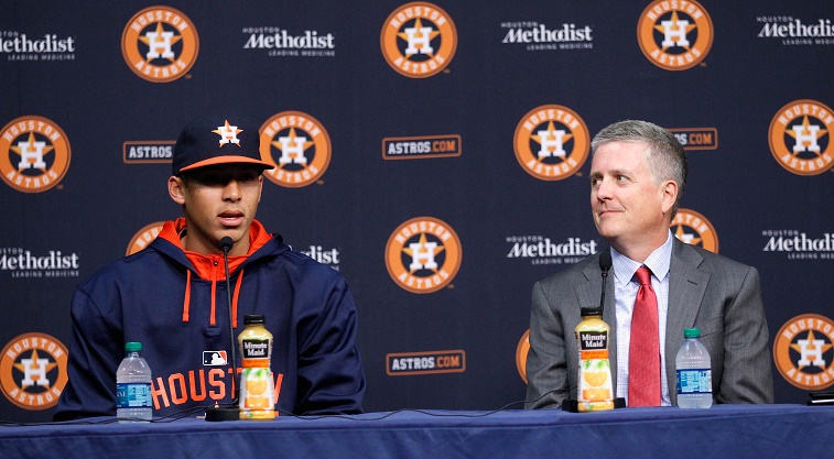 HOUSTON, TX - JUNE 12:  Carlos Correa #1 of the Houston Astros and general manager Jeff Luhnow asnwer questions from the media at Minute Maid Park on June 12, 2015 in Houston, Texas. 