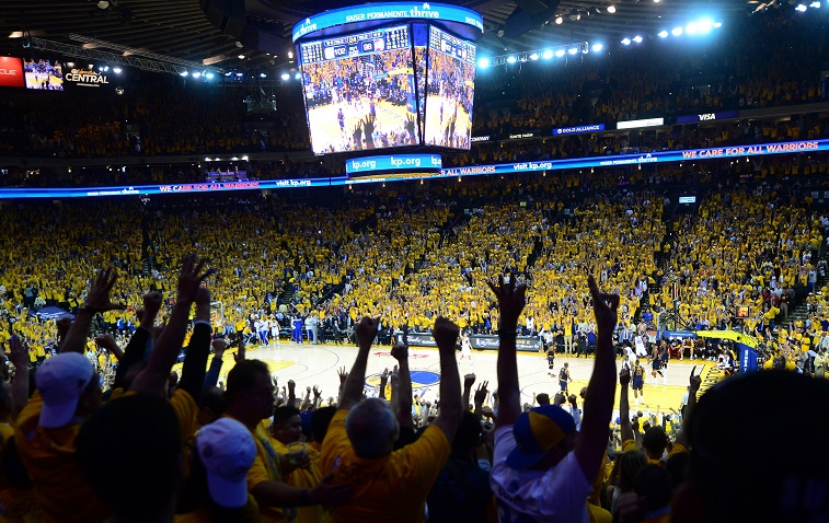 Golden State Warriors fans celebrate a win in Oakland.