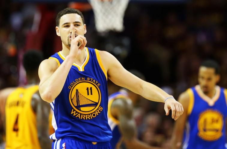Klay Thompson puts a finger to his lips after draining a three.