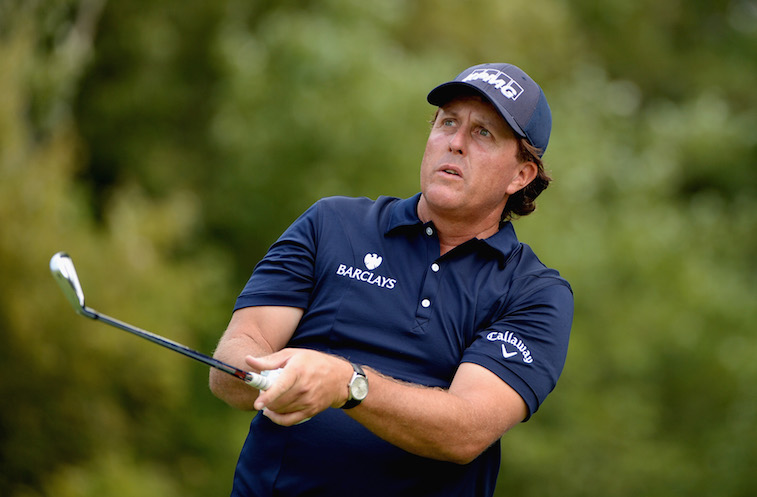 Phil Mickelson hits an approach shot