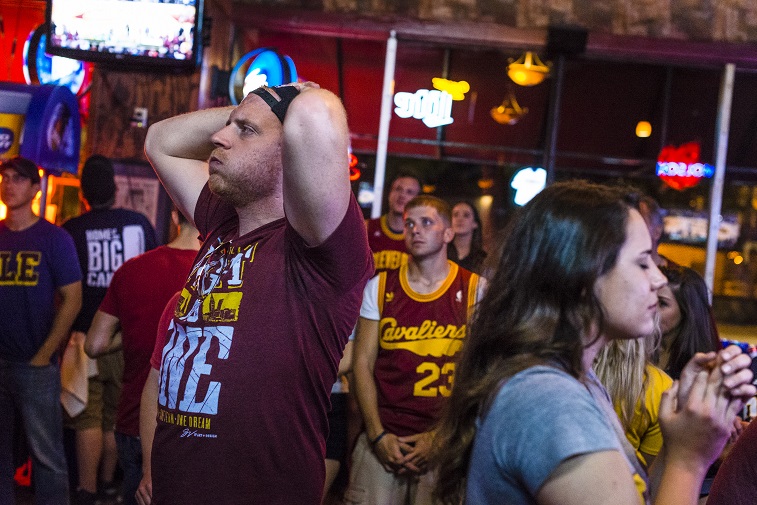 CLEVELAND, OH- JUNE 16: Cleveland Cavaliers fans react during game 6 of the NBA finals on June 16, 2015 in Cleveland, Ohio. The Golden State Warriors defeated The Cleveland Cavaliers 105-97 to win their first championship since 1975.