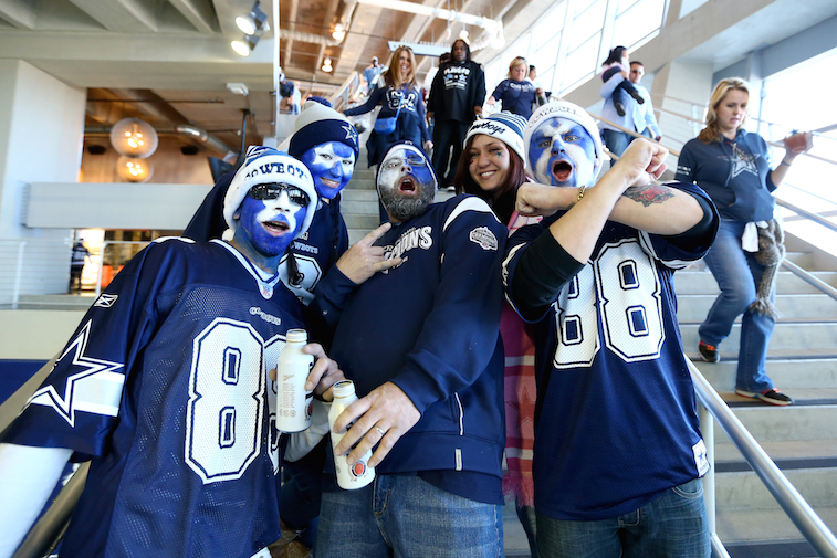 Cowboys fans pose for a picture.