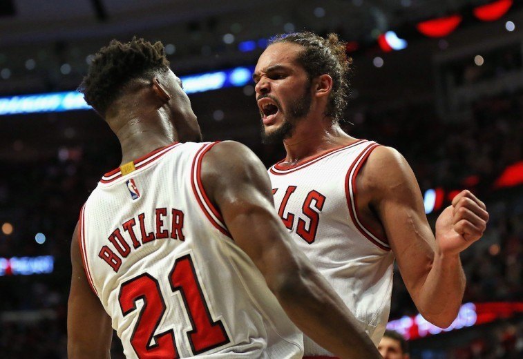 Jimmy Butler and Joakim Noah chest bump during the NBA Playoffs