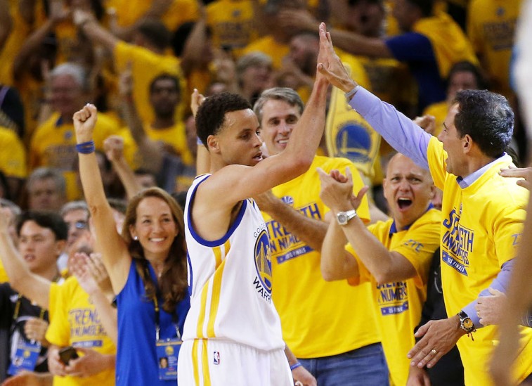 Stephen Curry celebrates with the fans at Oracle Arena