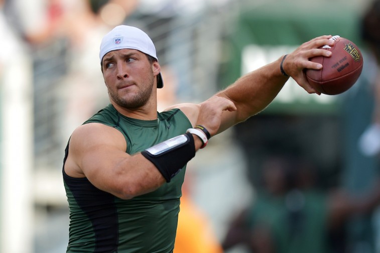 Tim Tebow throws before a Jets preseason game
