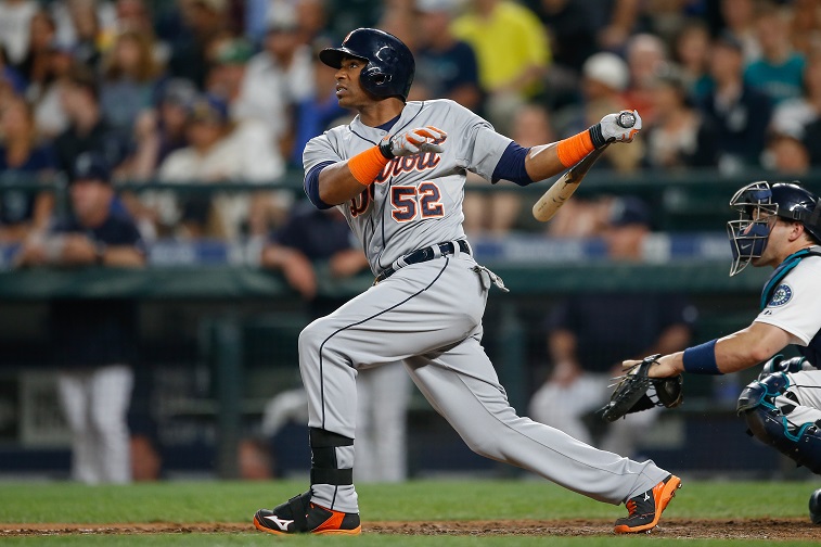 SEATTLE, WA - JULY 07:  Yoenis Cespedes #52 of the Detroit Tigers hits a game-tying solo home run against the Seattle Mariners in the eighth inning at Safeco Field on July 7, 2015 in Seattle, Washington. 