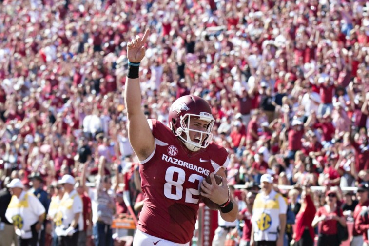 Luke Rossi scores a touchdown for Arkansas