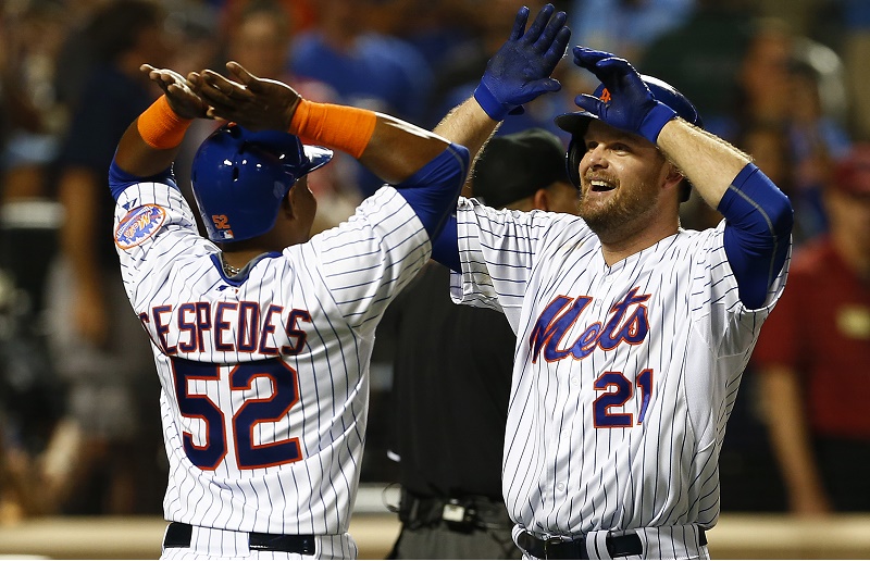 Lucas Duda #21 of the New York Mets is congratulated by Yoenis Cespedes #52 after both scored on Duda's two run home run 