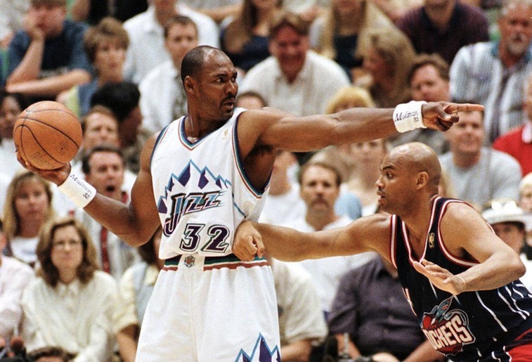 Karl Malone (L) is guarded by Charles Barkley