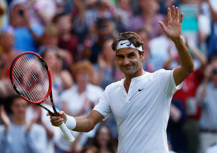 Roger Federer acknowledges the crowd after a victory at Wimbledon 