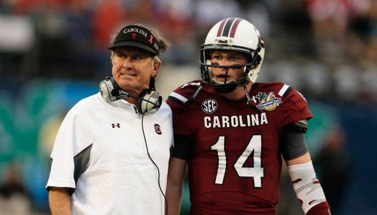 Steve Spurrier talks to quarterback Connor Shaw
