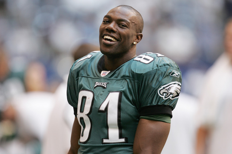 Terrell Owens smiles from the sidelines