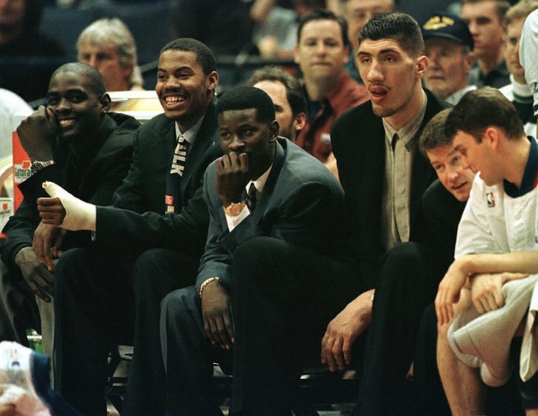 The Washington Bullets bench -- far right, Mark Price talks to brother Brent