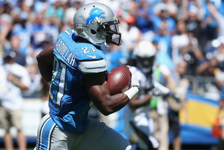 Running back Ameer Abdullah #21 of the Detroit Lions scores a touchdown.