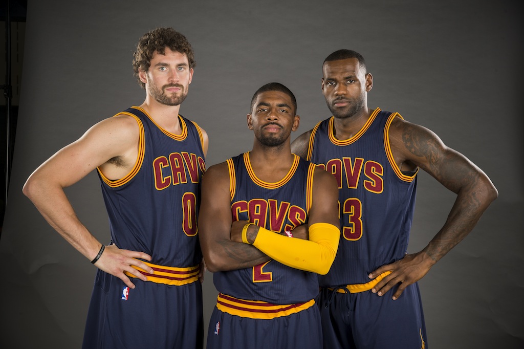 Kevin Love, Kyrie Irving, and LeBron James pose for a photo as they represent Cleveland's Big Three.