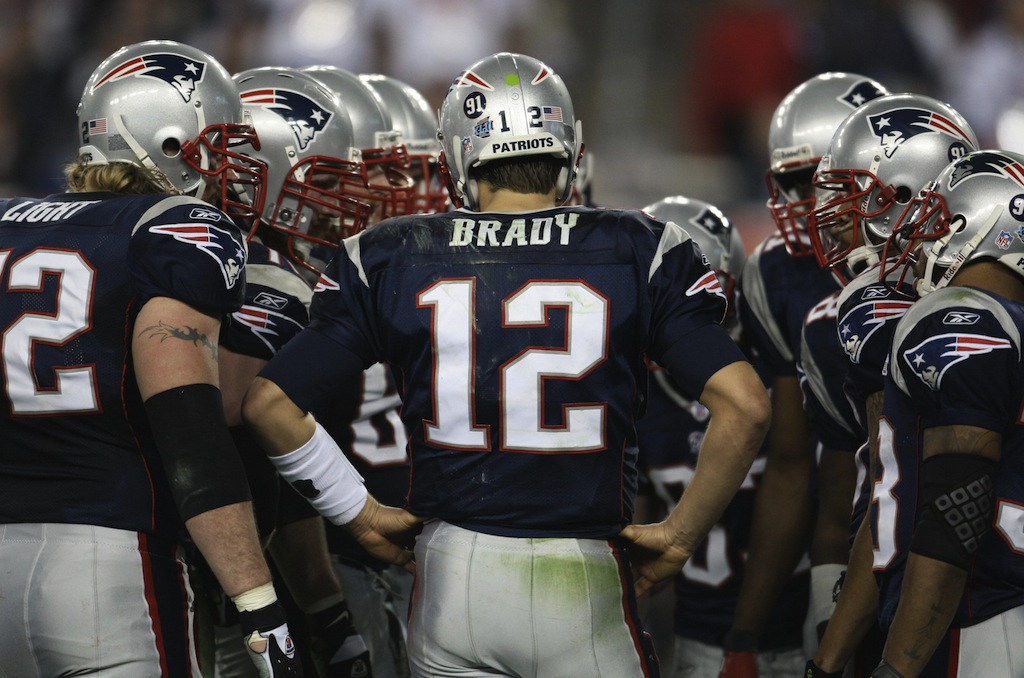 New England Patriots Tom Brady talks to his teammates during Super Bowl XLII against the New York Giants 