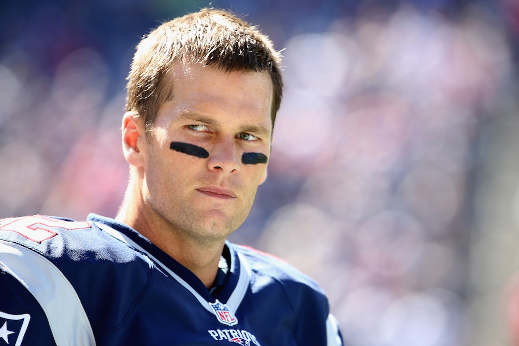Tom Brady looks across the football field.