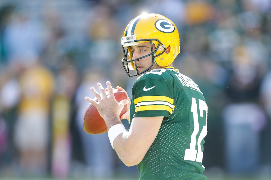 Aaron Rodgers warms up