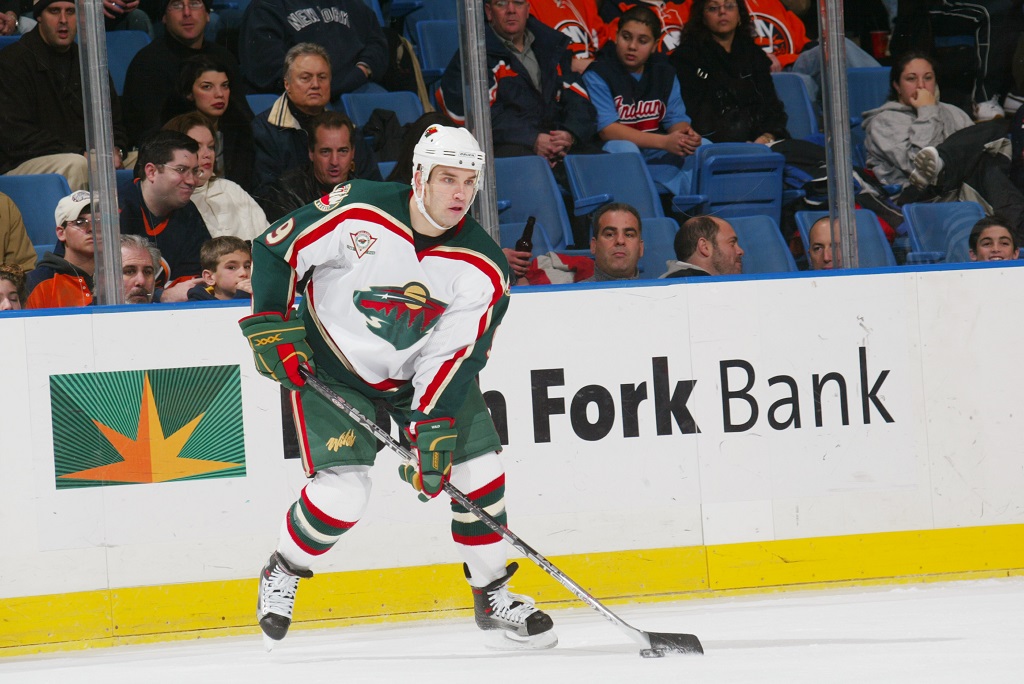 UNIONDALE, NY - DECEMBER 13: Right wing Alexandre Daigle #9 of the Minnesota Wild handles the puck against the New York Islanders at the Nassau Coliseum on December 13, 2005 in Uniondale, New York. The Wild defeated the Islanders 4-3.