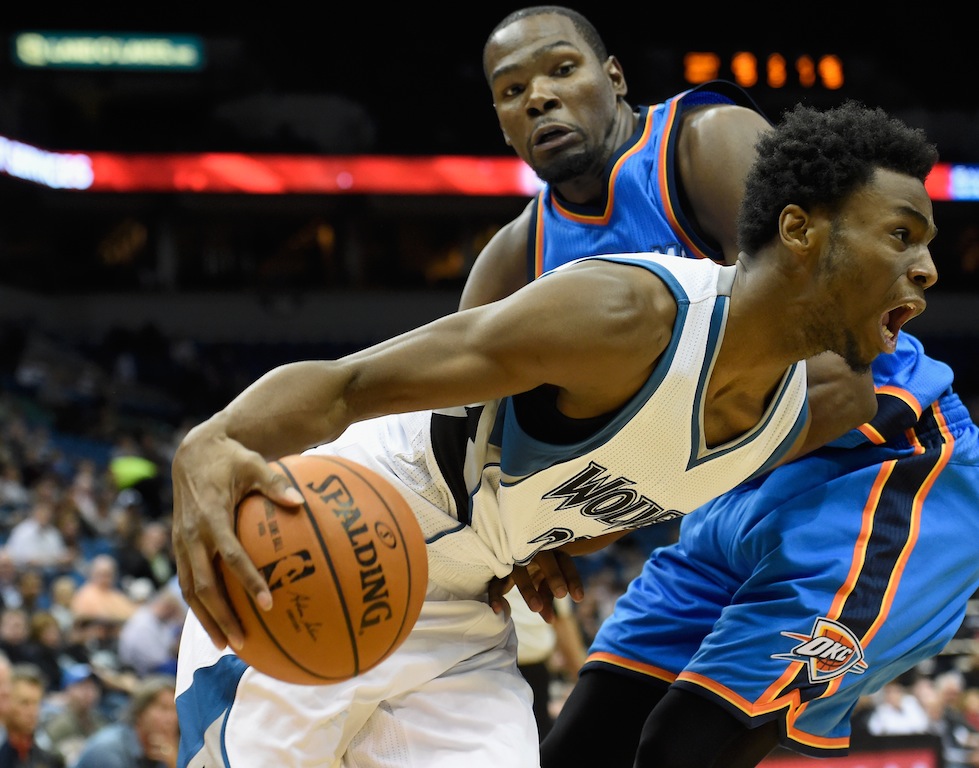 Andrew Wiggins drives past Kevin Durant