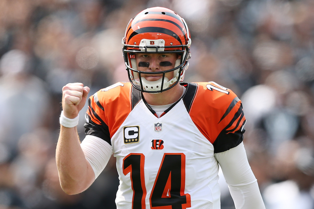 Andy Dalton fist pumps after throwing a touchdown pass.