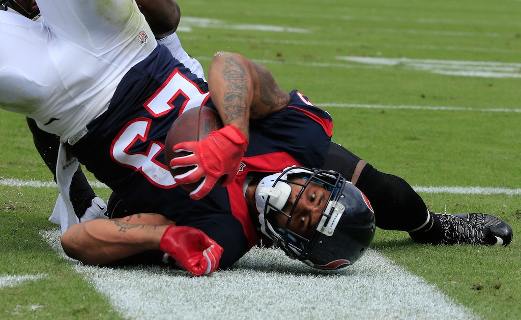 Arian Foster tackled during a game against the Jaguars