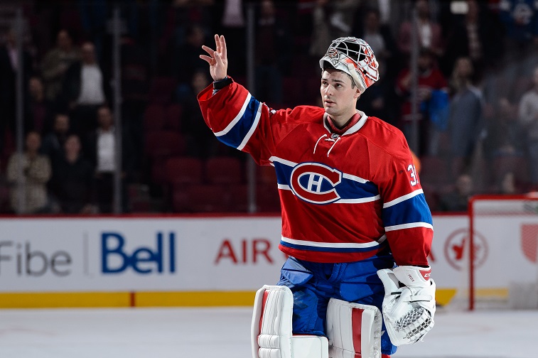 MONTREAL, QC - OCTOBER 15: Carey Price #31 of the Montreal Canadiens salutes the fans after being awarded the first star of the game during the NHL match against the New York Rangers at the Bell Centre on October 15, 2015 in Montreal, Quebec, Canada. The Canadiens defeated the Rangers 3-0 and for the first time in franchise history, the Canadiens have won five games in a row to start the season.
