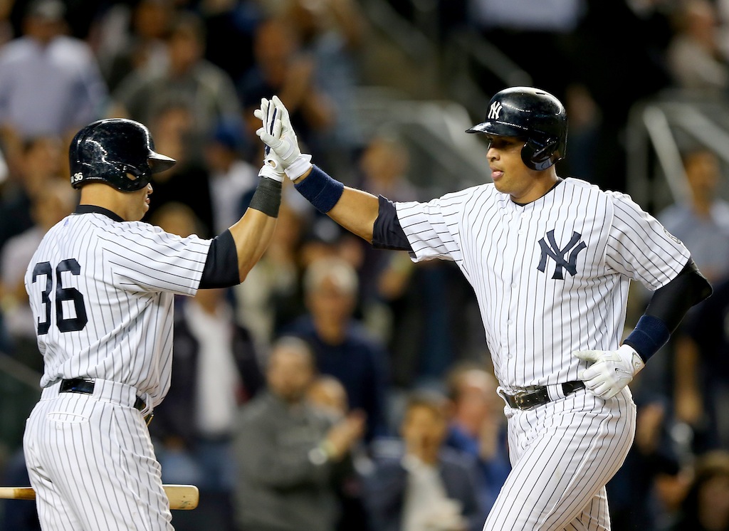 Carlos Beltran (L) and Alex Rodriguez high five