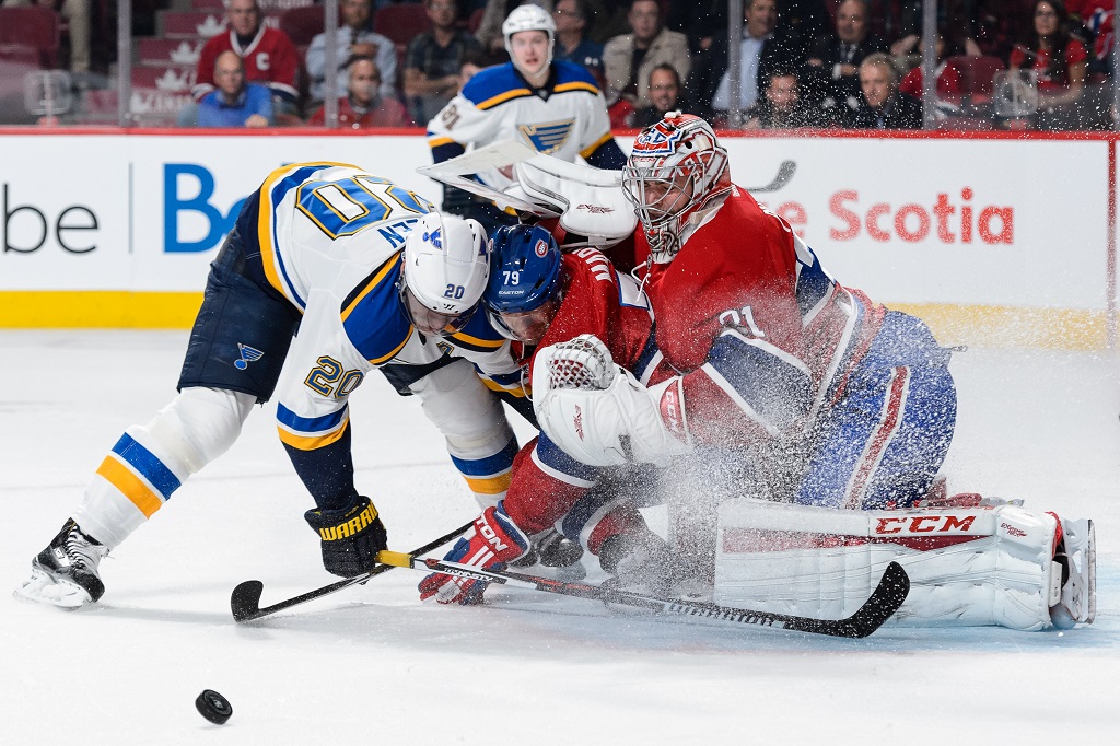 MONTREAL, QC - OCTOBER 20: Alexander Steen #20 of the St. Louis Blues and Andrei Markov #79 of the Montreal Canadiens crash into goaltender Carey Price #31 during the NHL game at the Bell Centre on October 20, 2015 in Montreal, Quebec, Canada.