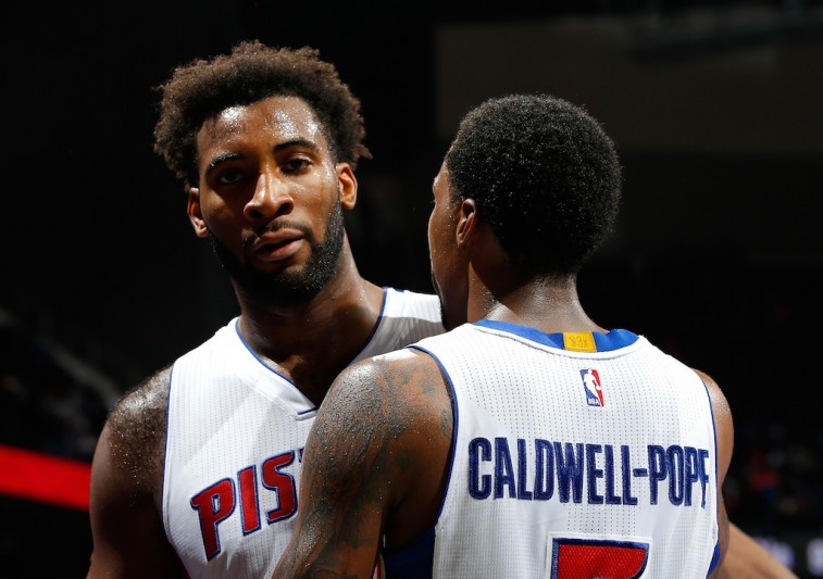 Andre Drummond and Kentavious Caldwell-Pope talk to each other on the court.