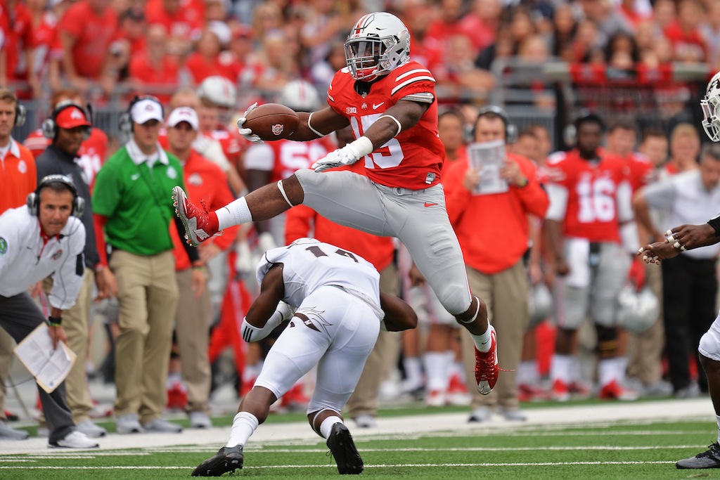 Ezekiel Elliott hurdles a Western Michigan defender
