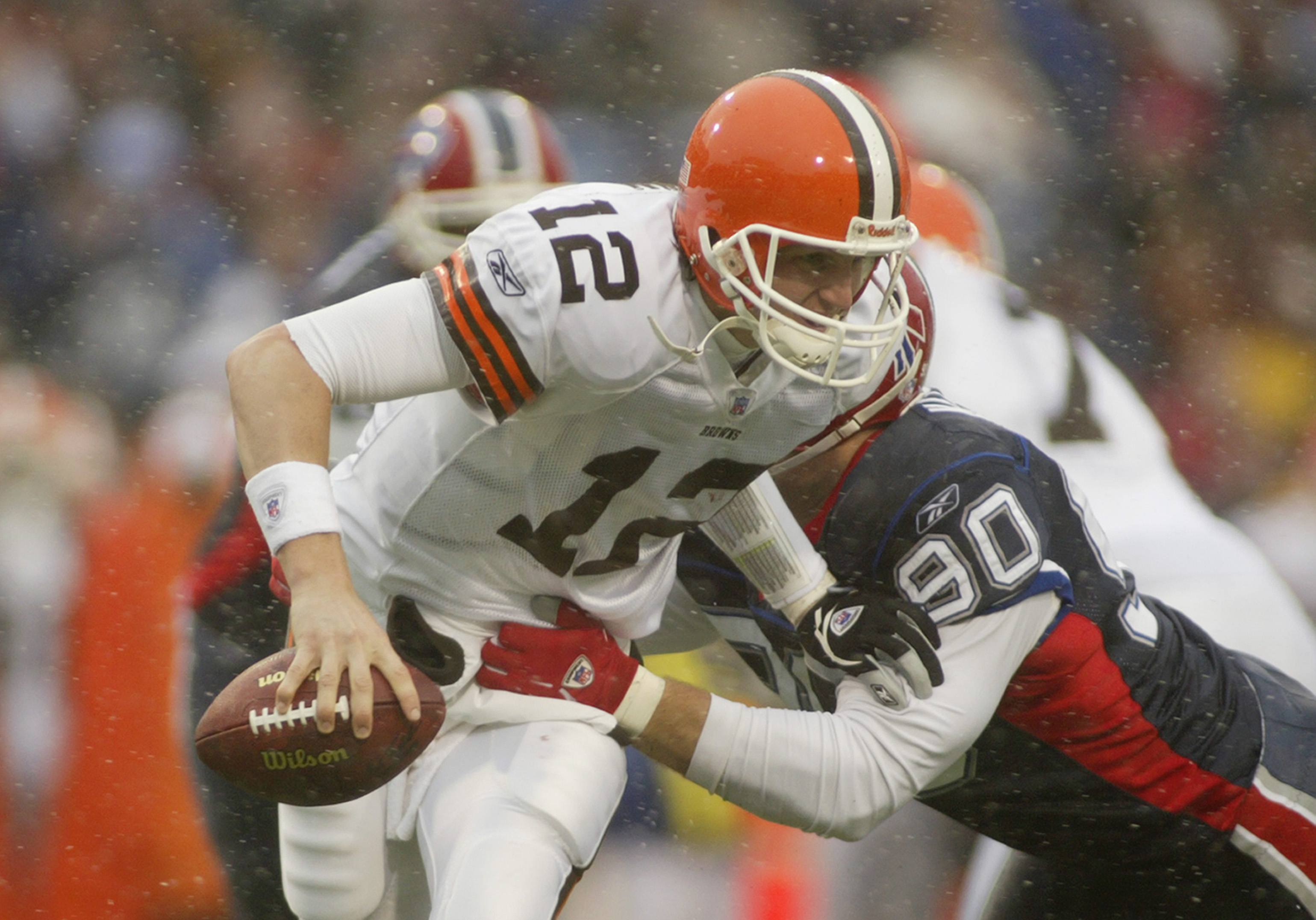 Quarterback Luke McCown of the Cleveland Browns is sacked by defensive end Chris Kelsay.