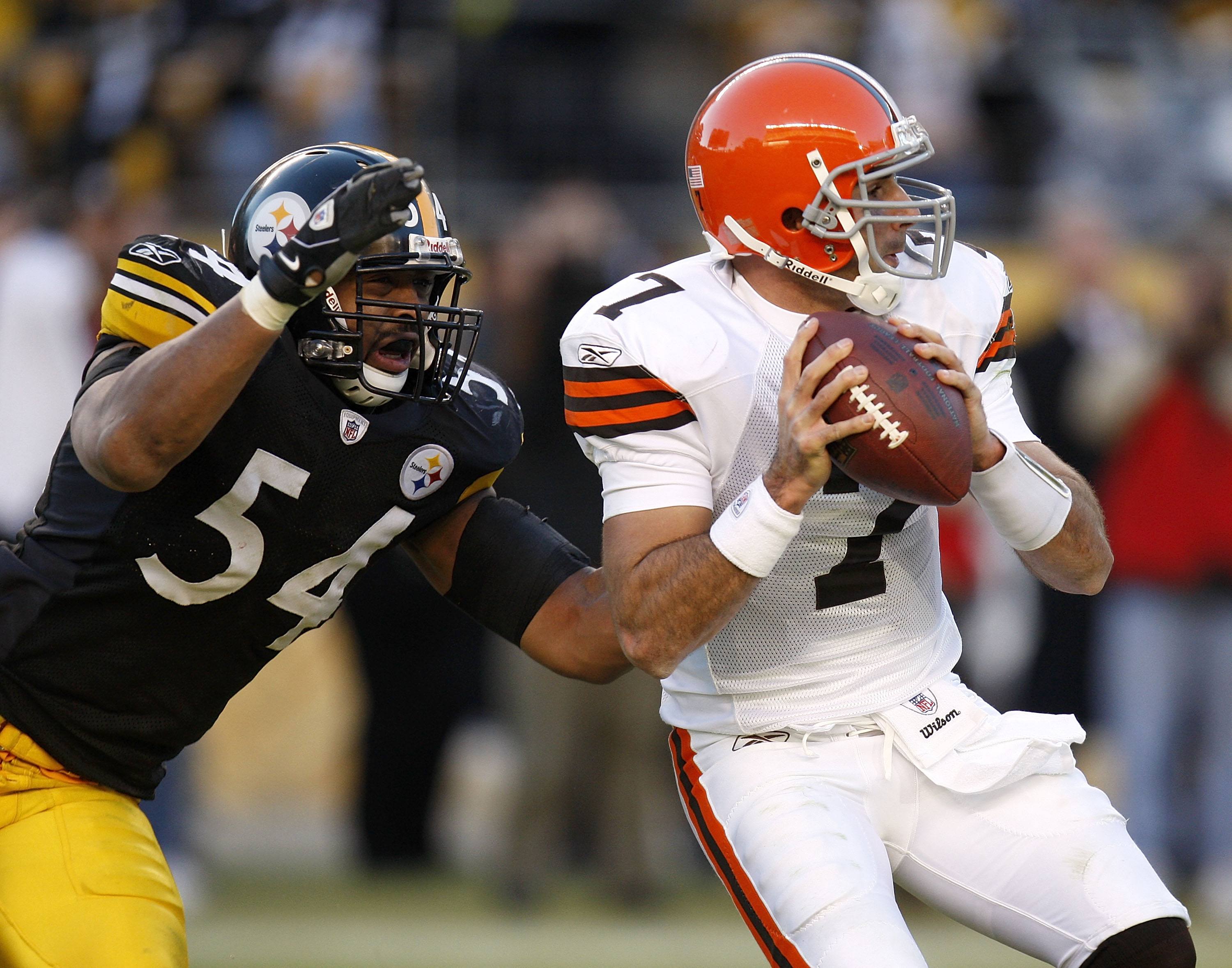 Bruce Gradkowski of the Cleveland Browns gets sacked by Andre Frazier of the Pittsburgh Steelers.