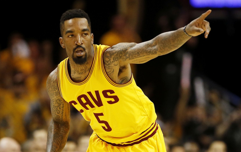 J.R. Smith motions to his teammates. 