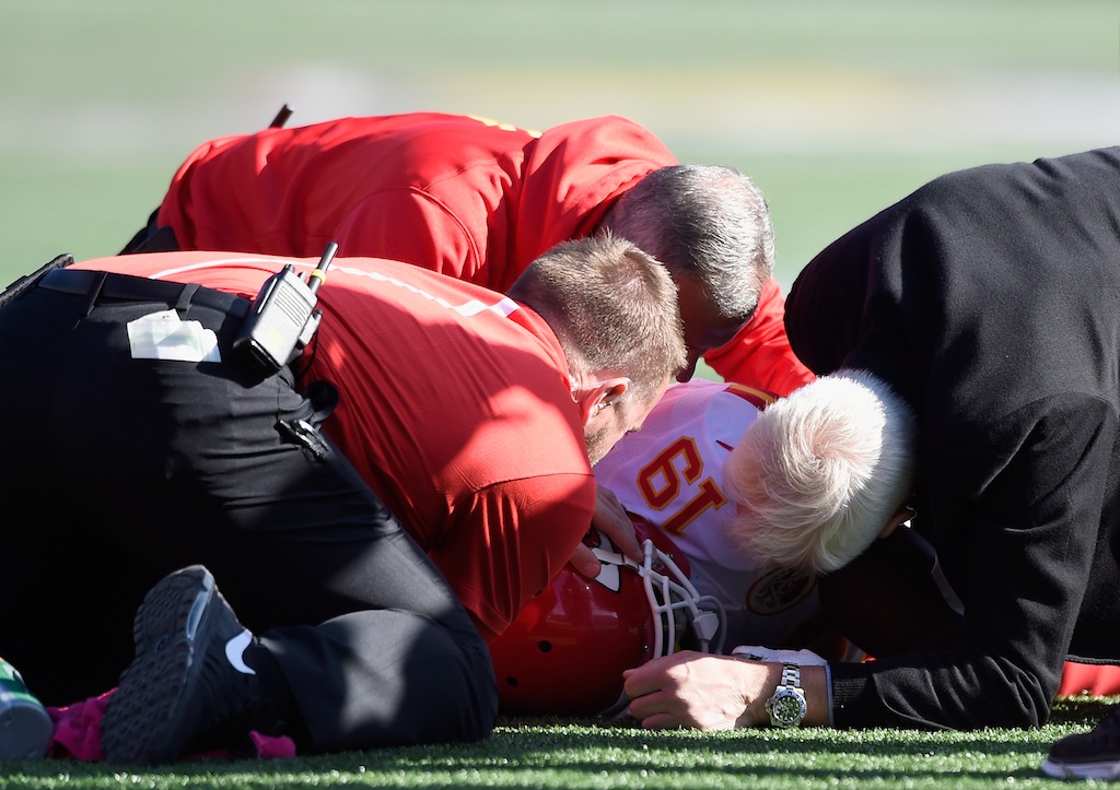 Trainers tend to Jeremy Maclin after an injury