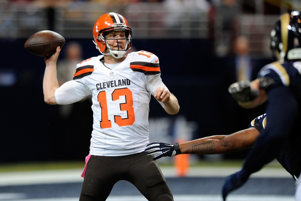 Josh McCown attempts to throw against the Rams