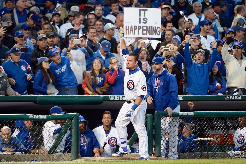 Kyle Schwarber waves to Chicago Cubs fans.