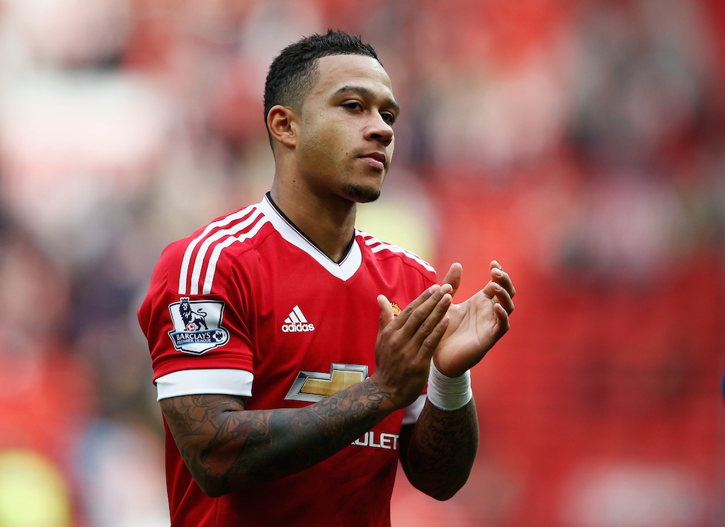 Memphis Depay applauds after a Manchester United victory