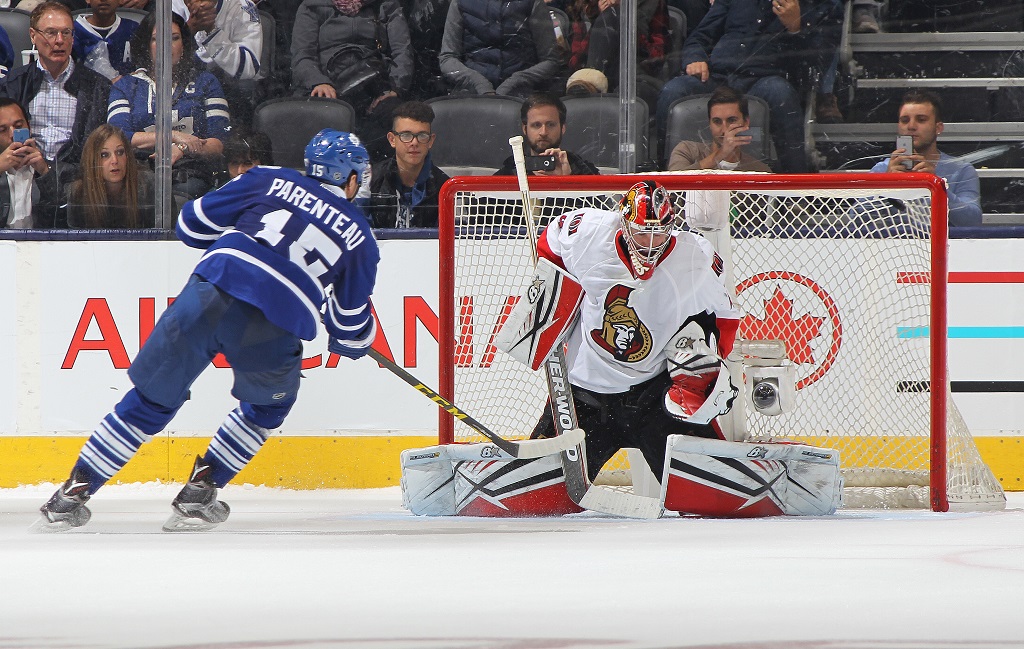 TORONTO, ON - OCTOBER 10: PA Parenteau #15 of the Toronto Maple Leafs beats Craig Anderson #41 of the Ottawa Senators in the shoot-out during an NHL game at the Air Canada Centre on October 10, 2015 in Toronto, Ontario, Canada. The Senators defeated the Leafs 5-4 in an overtime shoot-out.