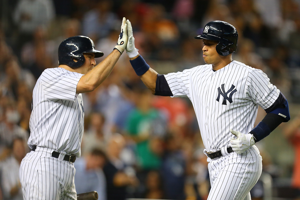 Mike Stobe/Getty Images Alex Rodriguez #13 is greeted by Mark Teixeira #25 after connecting on a solo home run 