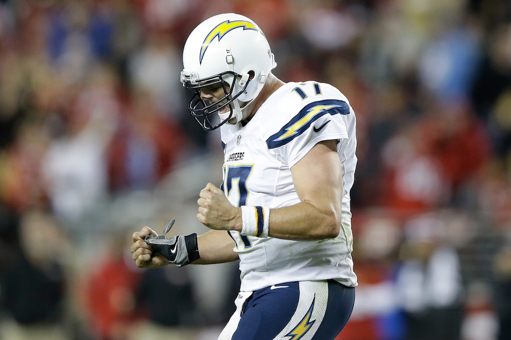 philip Rivers clenches his fists after throwing a touchdown pass.