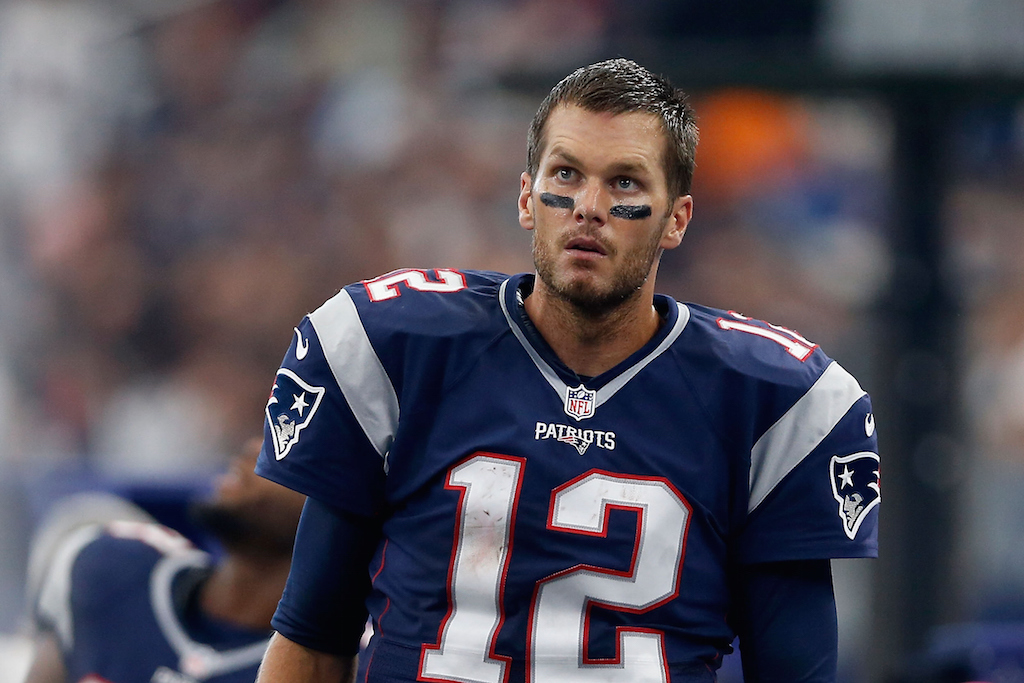 Tom Brady looks stressed as he looks up at the scoreboard.