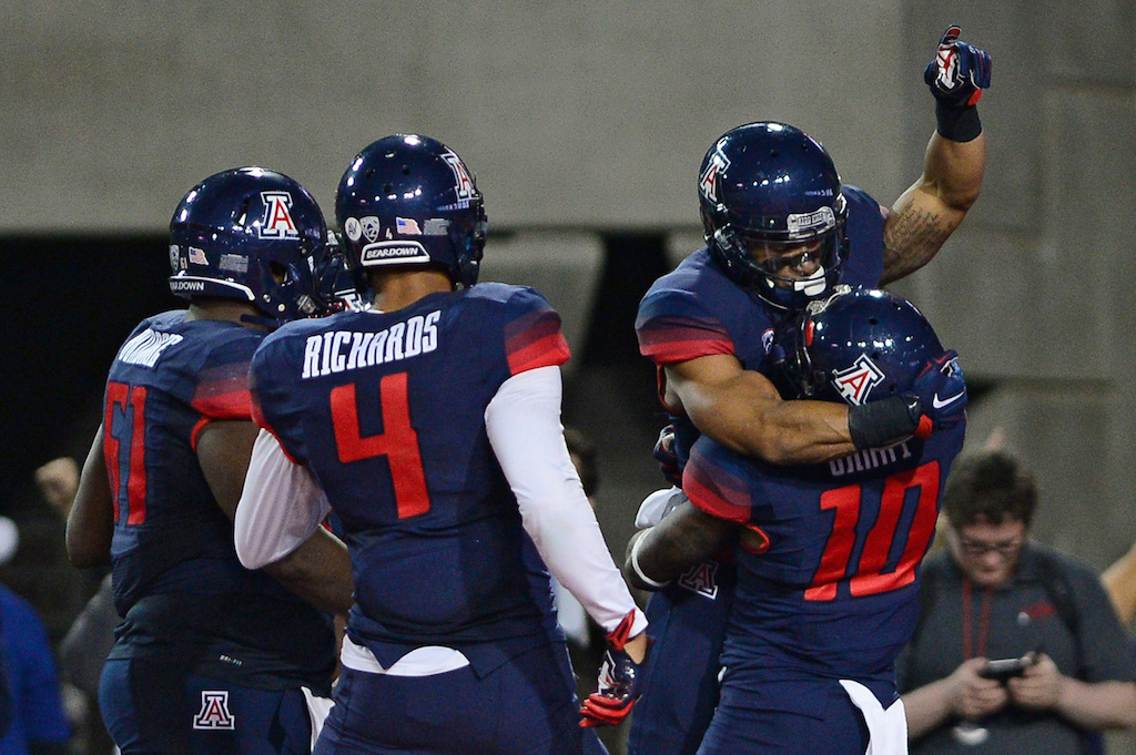 Arizona Wildcats celebrate the game-winning touchdown