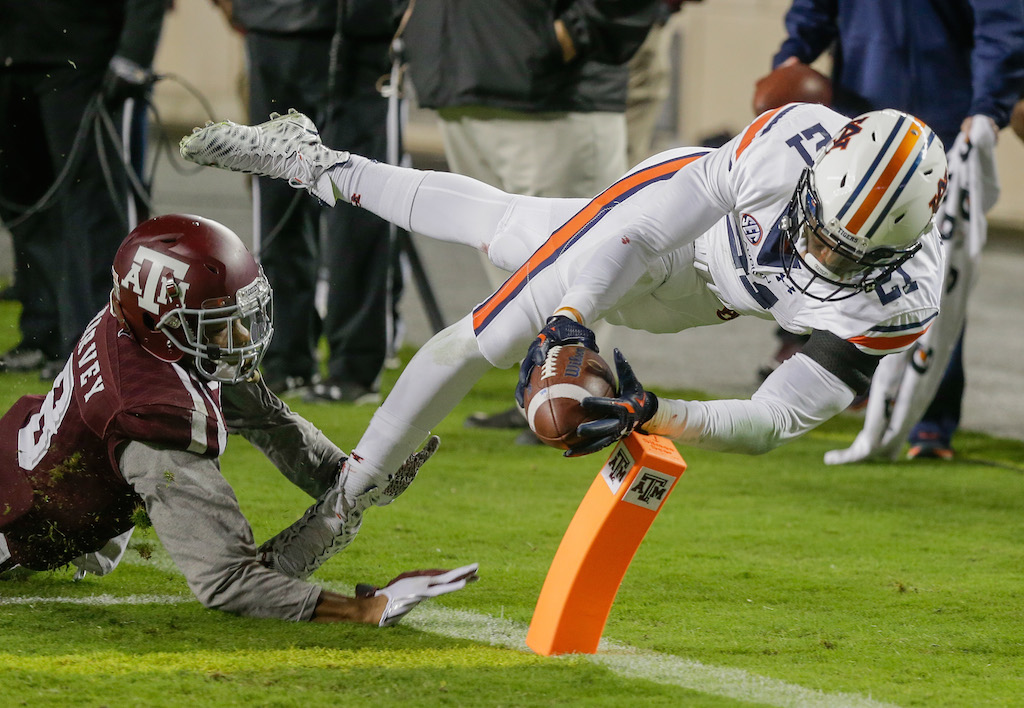 Kerryon Johnson #21 of the Auburn Tigers steps out of bounds