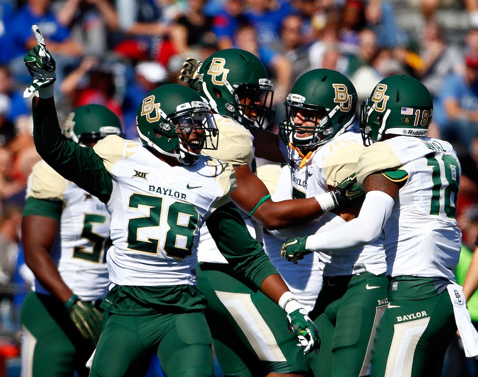 LAWRENCE, KS - OCTOBER 10: Safety Orion Stewart #28 of the Baylor Bears celebrates after a fumble recovery during the game against the Kansas Jayhawks at Memorial Stadium on October 10, 2015 in Lawrence, Kansas. (Photo by Jamie Squire/Getty Images)