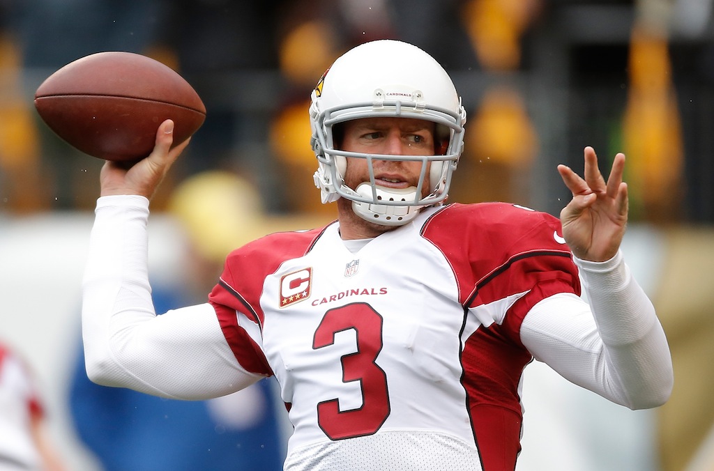 Carson Palmer warms up before a game against the Steelers