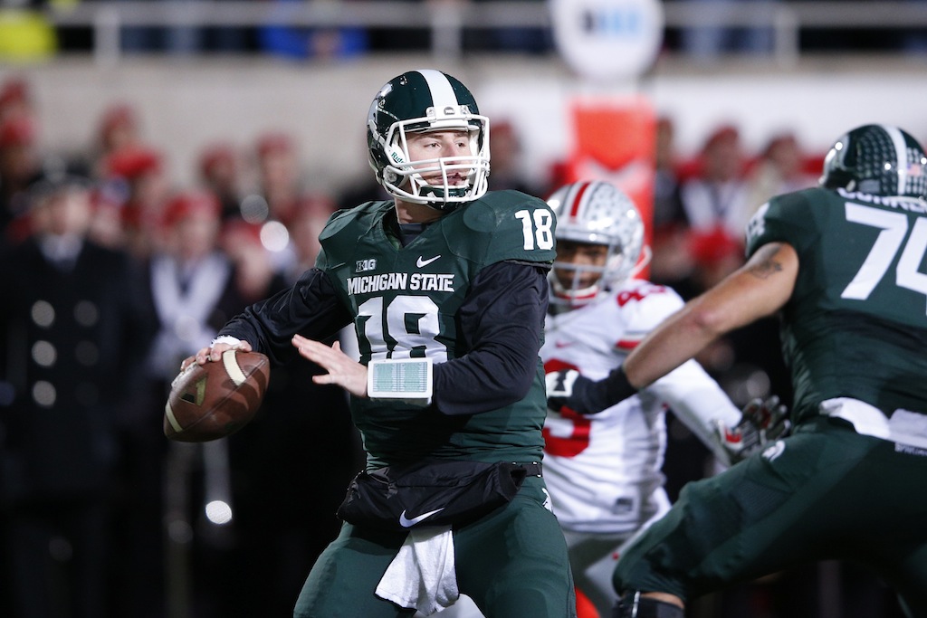 Connor Cook throws against Ohio State