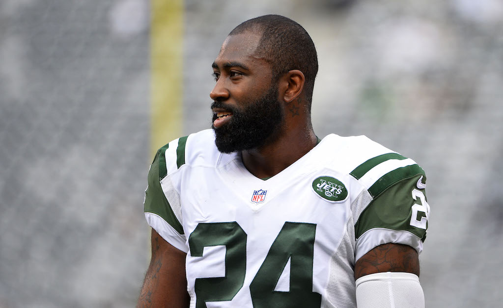 Darrelle Revis of the New York Jets talks during warmups | Alex Goodlett/Getty Images