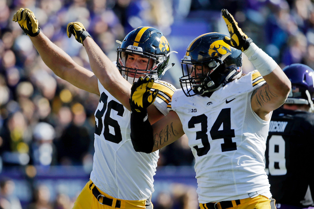 Cole Fisher #36 of the Iowa Hawkeyes celebrates with Nate Meier #34 (R) after blocking a pass against the Northwestern Wildcats